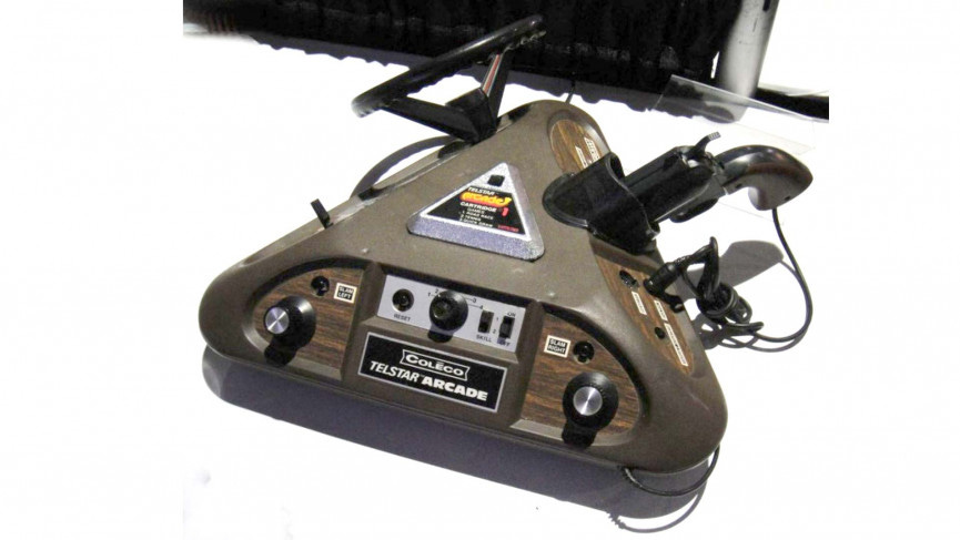 A hideous retro controller chaped like a pyramid with several attachments and knobs.
