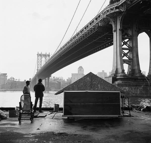 “Mack’s First House, East River 1992,” from Margaret Morton’s book “Fragile Dwelling” (2000). Ms. Morton explored New York City’s hidden encampments and became an advocate for the homeless.