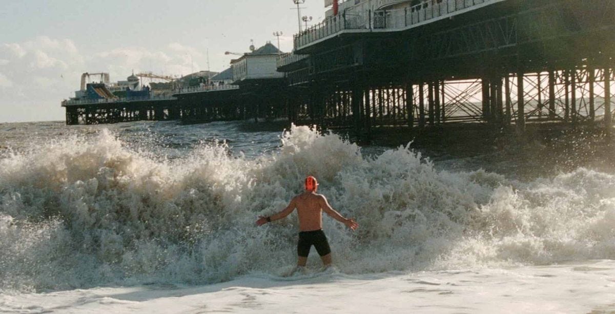 man enters the cold waves of the english channel