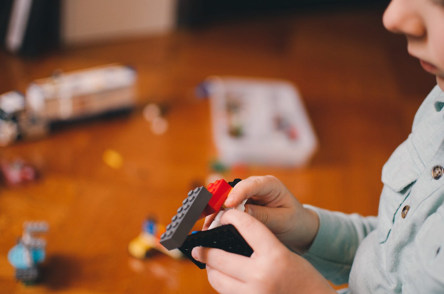 Child playing with lego for article by Larry G. Maguire Child playing with lego for article by Larry G. Maguire