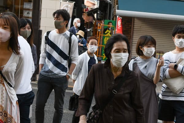 Shoppers in Tokyo last month. Face masks were a common sight in the city long before the coronavirus arrived.