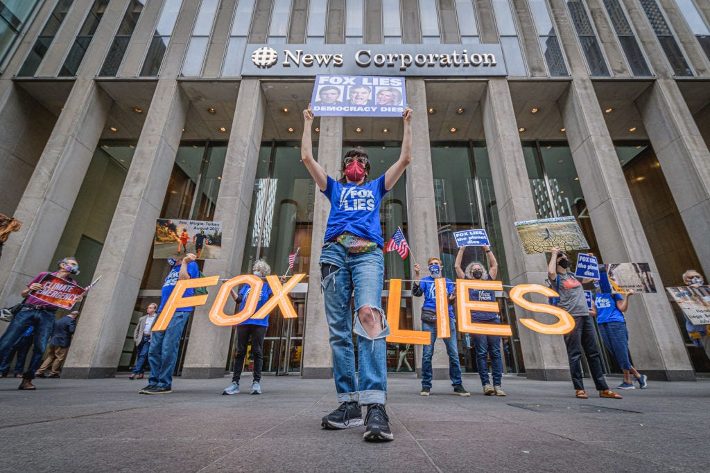 Protesters gather in front of Fox Headquarters in Manhattan in September to protest the network's promotion of climate misinformation. (Erik McGregor / Getty Images) Protesters gather in front of Fox Headquarters in Manhattan in September to protest the network's promotion of climate misinformation. (Erik McGregor / Getty Images)