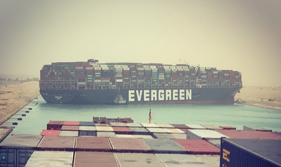 Picture of container ship with the owner's name "EVERGREEN" prominently visible Picture of container ship with the owner's name "EVERGREEN" prominently visible