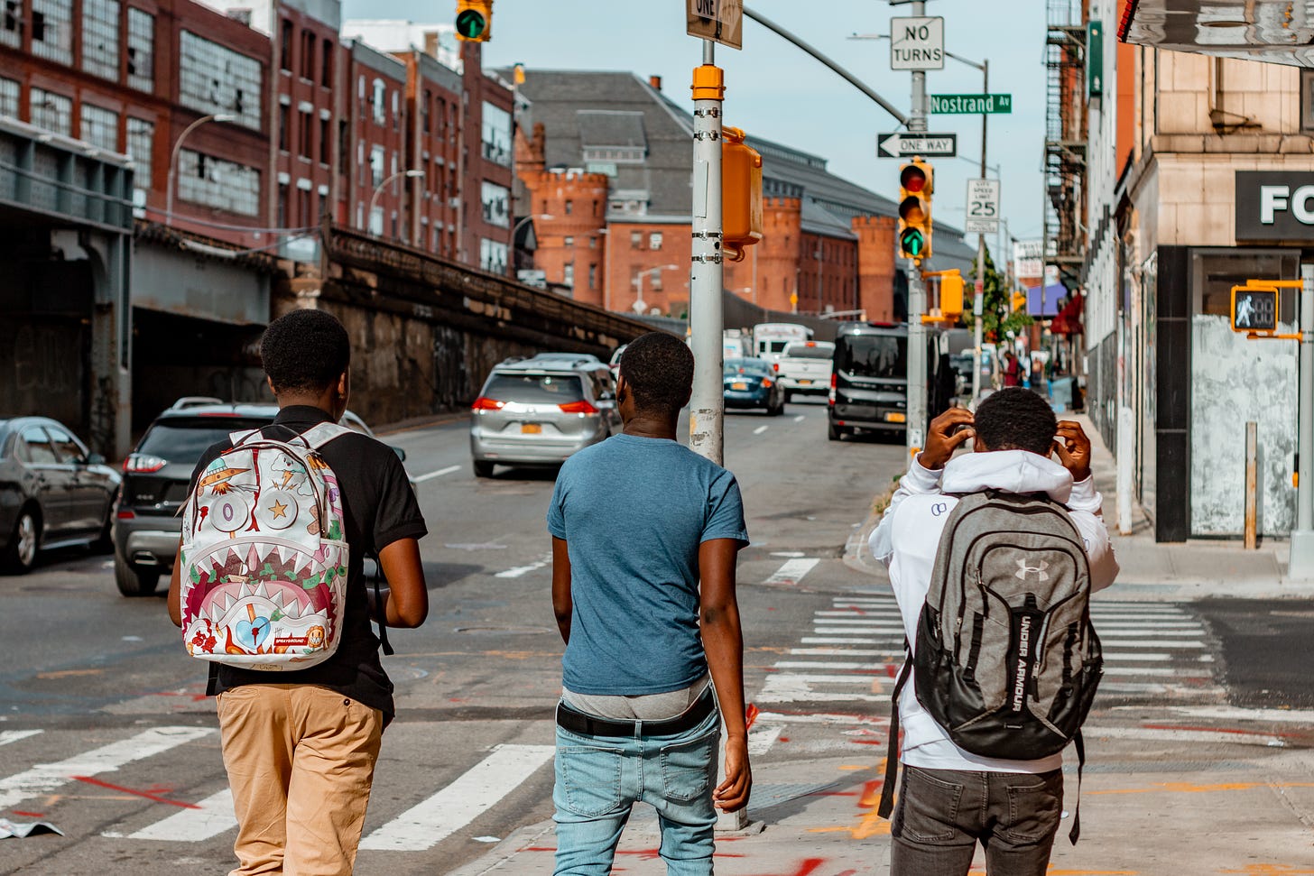 Three men walking at the sidewalk in New York: A photo by David Elikwu