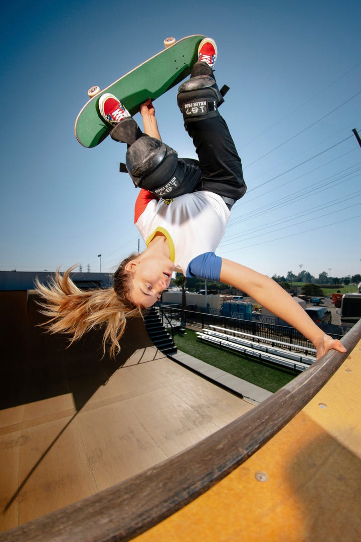 null A person doing a trick on a skateboard on a ramp
Description automatically generated