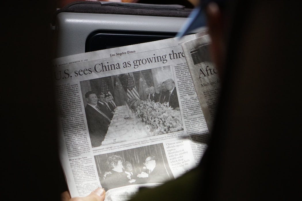 Person holds Los Angeles Times newspaper from December 31, 2018. Headline reads: ‘U.S. sees China as growing threat’.