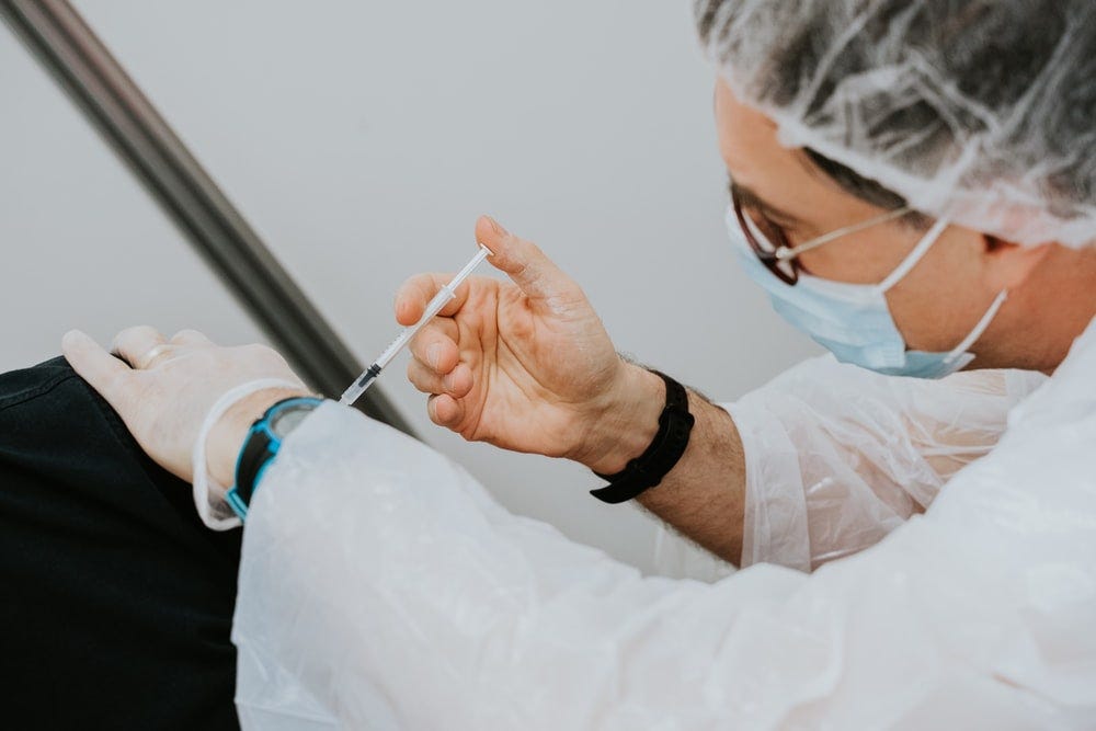 person in white long sleeve shirt holding gray pen person in white long sleeve shirt holding gray pen