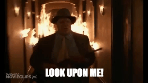 John Goodman races through a burning hallway with a rifle and says, "Look upon me! I'll show you the life of the mind!" [gif]