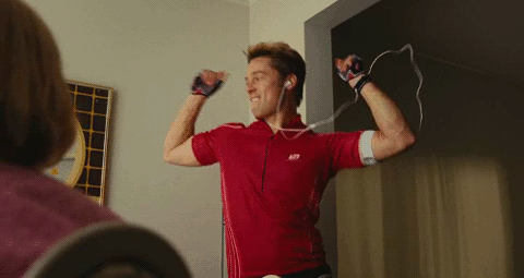Brad Pitt celebrates whilst dressed as a gym trainer in Burn After Reading [gif].