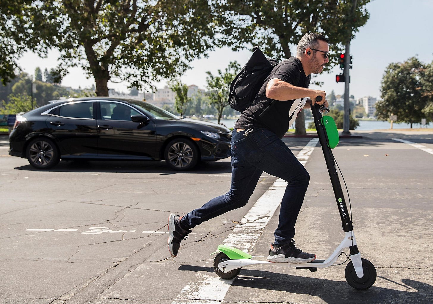 Image result for scooter next to car
