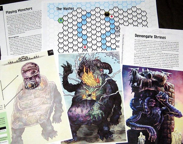Printed-out pages of my next book-in-progress, Only Monsters Here, showing some monsters and some maps.