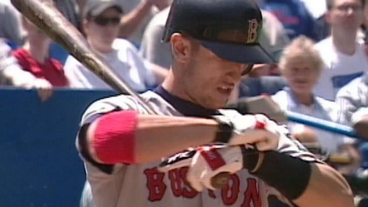 Nomar Garciaparra in the rare Red Sox white cap from the late 90s